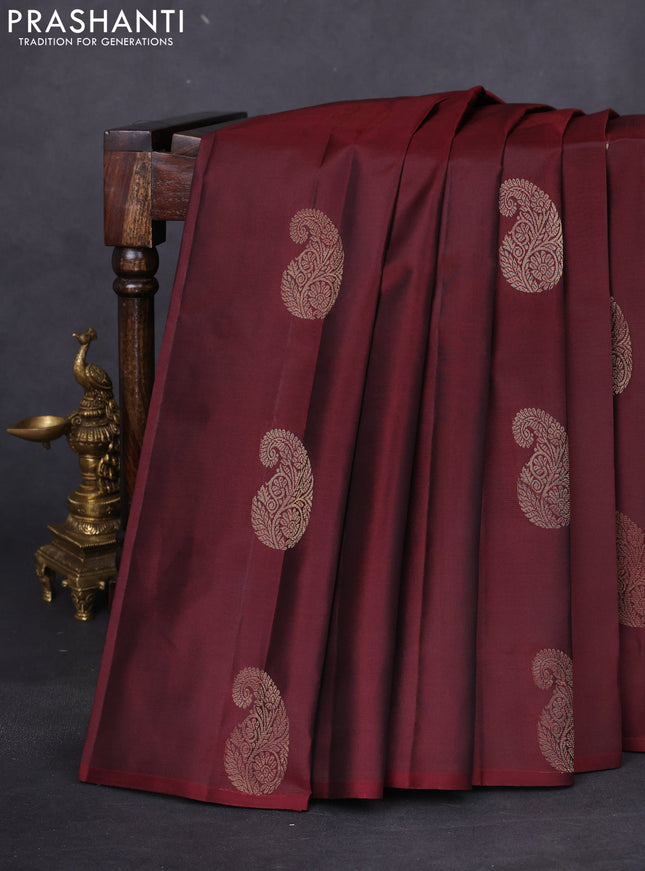Pure kanchipuram silk saree deep maroon and teal green with zari woven paisley buttas in borderless style