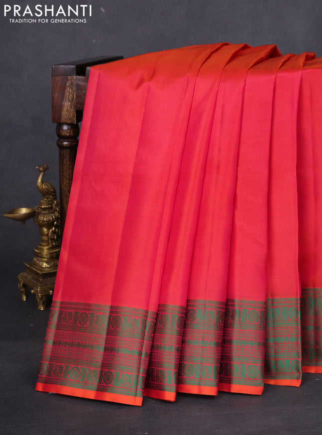 Pure kanchipuram silk saree dual shade of pinkish orange and green with plain body and thread woven border