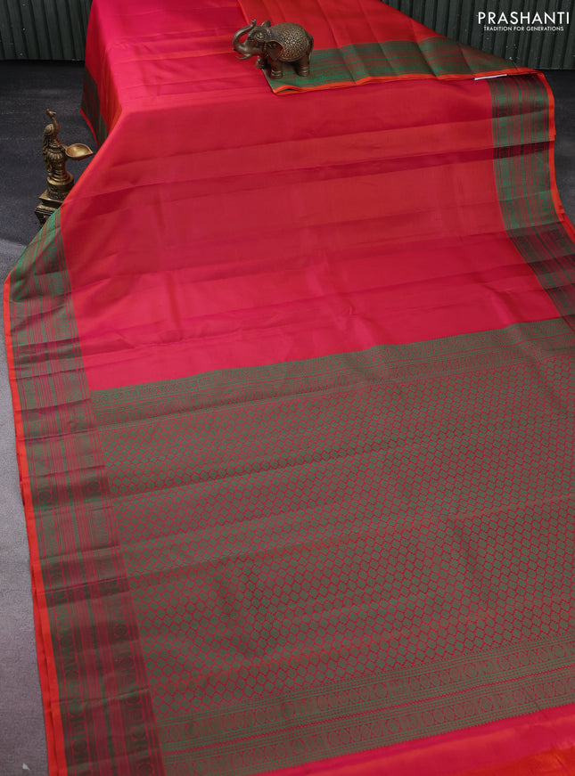 Pure kanchipuram silk saree dual shade of pinkish orange and green with plain body and thread woven border