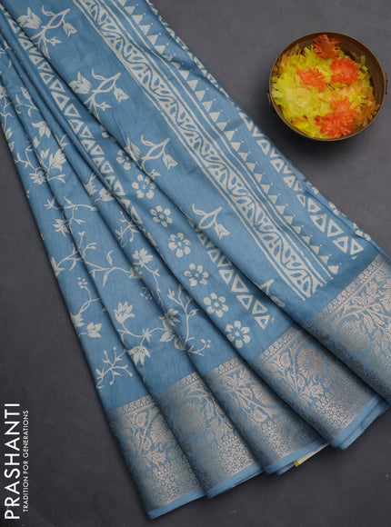 Semi dola saree blue shade with allover prints and zari woven border