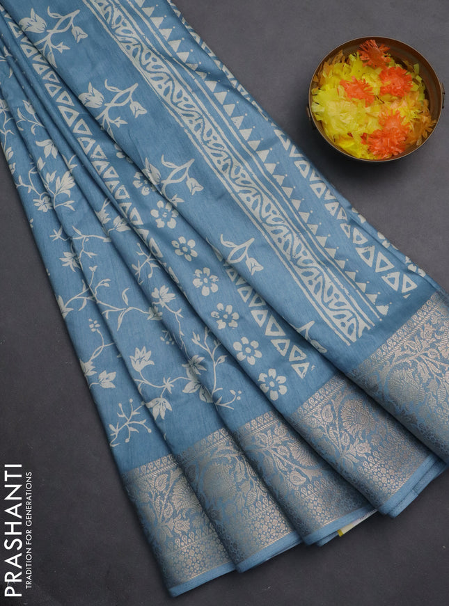 Semi dola saree blue shade with allover prints and zari woven border