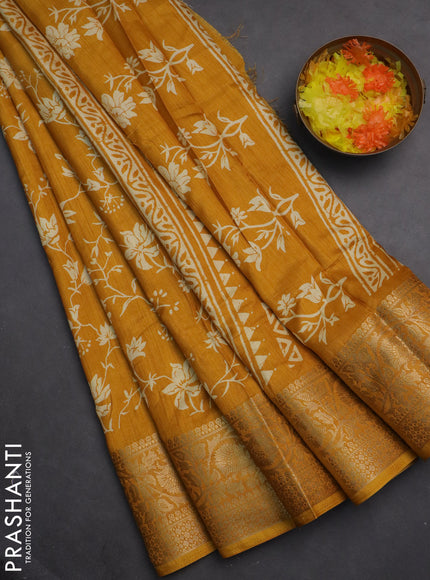 Semi dola saree mustard yellow with allover prints and zari woven border