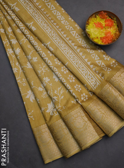 Semi dola saree pale yellow with allover prints and zari woven border