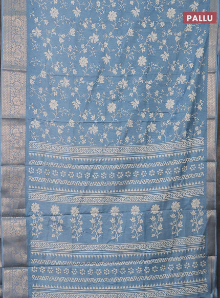 Semi dola saree blue shade with allover prints and zari woven border