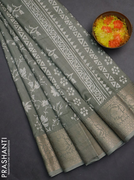 Semi dola saree pastel green with allover prints and zari woven border