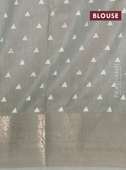 Semi dola saree pastel green with allover prints and zari woven border