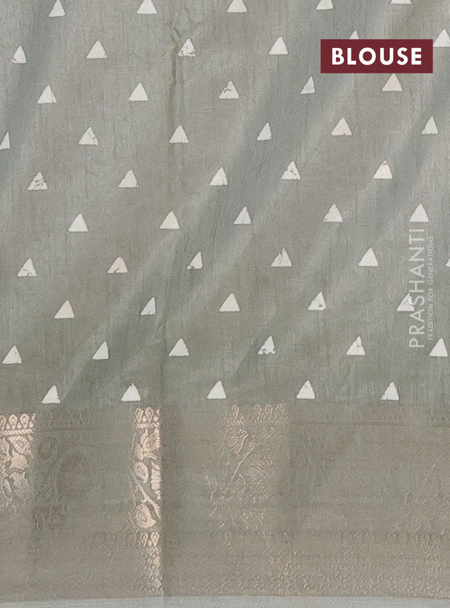 Semi dola saree pastel green with allover prints and zari woven border