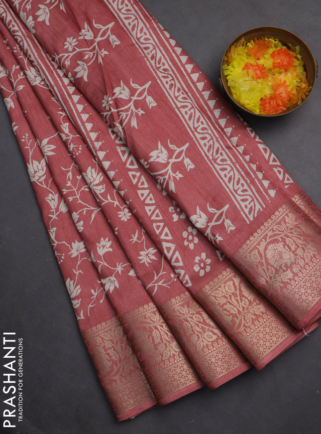 Semi dola saree peach shade with allover prints and zari woven border