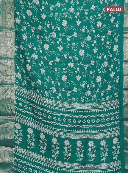 Semi dola saree teal blue with allover prints and zari woven border