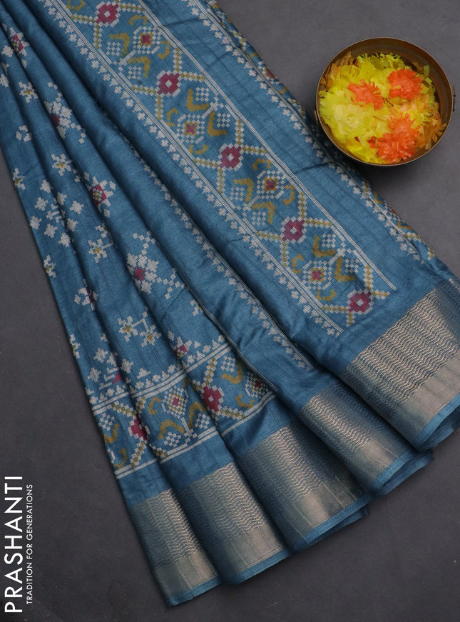 Semi dola saree blue shade with ikat prints and zari woven border