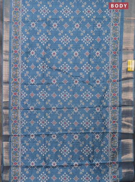 Semi dola saree blue shade with ikat prints and zari woven border