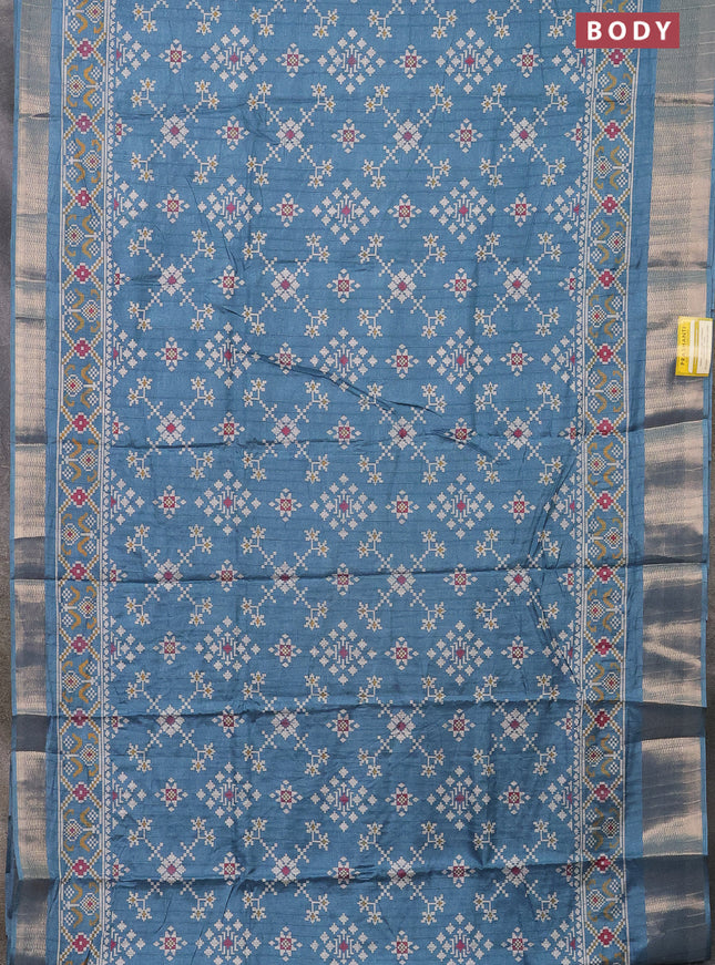 Semi dola saree blue shade with ikat prints and zari woven border