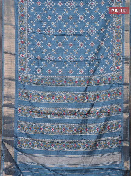 Semi dola saree blue shade with ikat prints and zari woven border