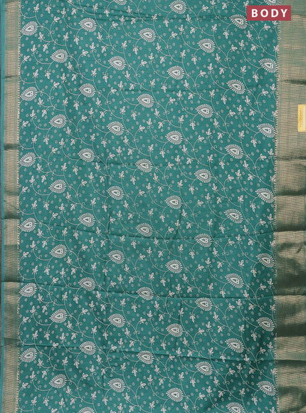Semi dola saree teal green with allover prints and zari woven border