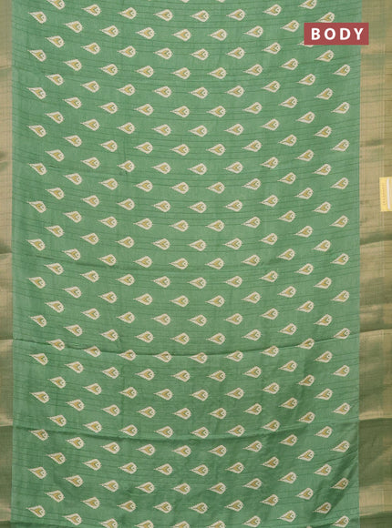 Semi dola saree green with butta prints and zari woven border