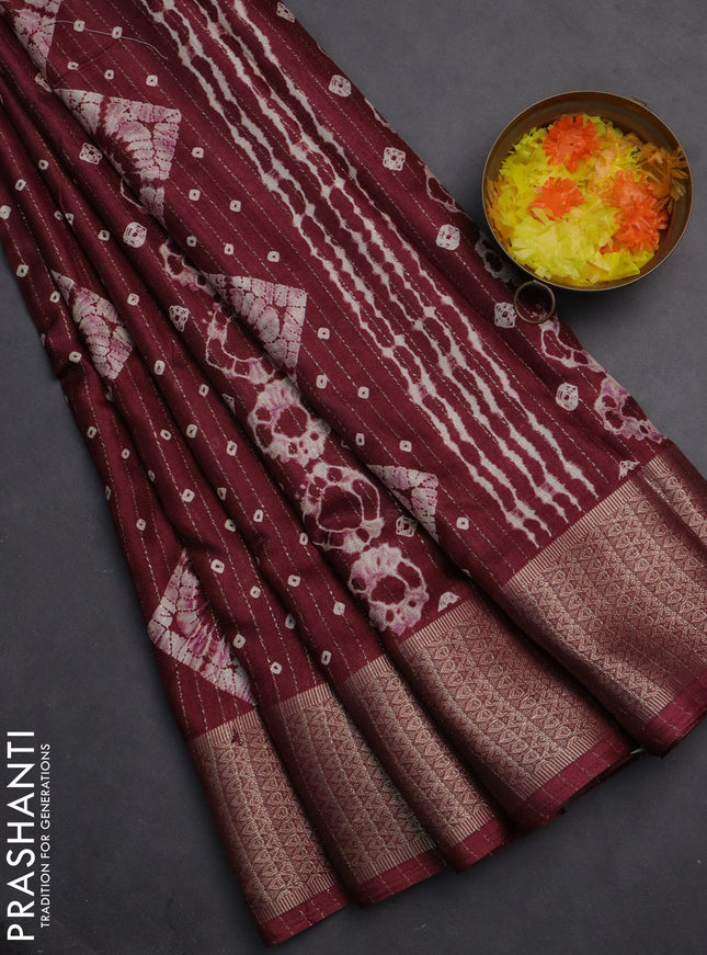 Semi dola saree maroon with allover zari weaves & batik prints and zari woven border
