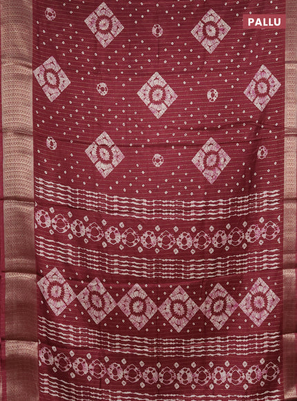 Semi dola saree maroon with allover zari weaves & batik prints and zari woven border
