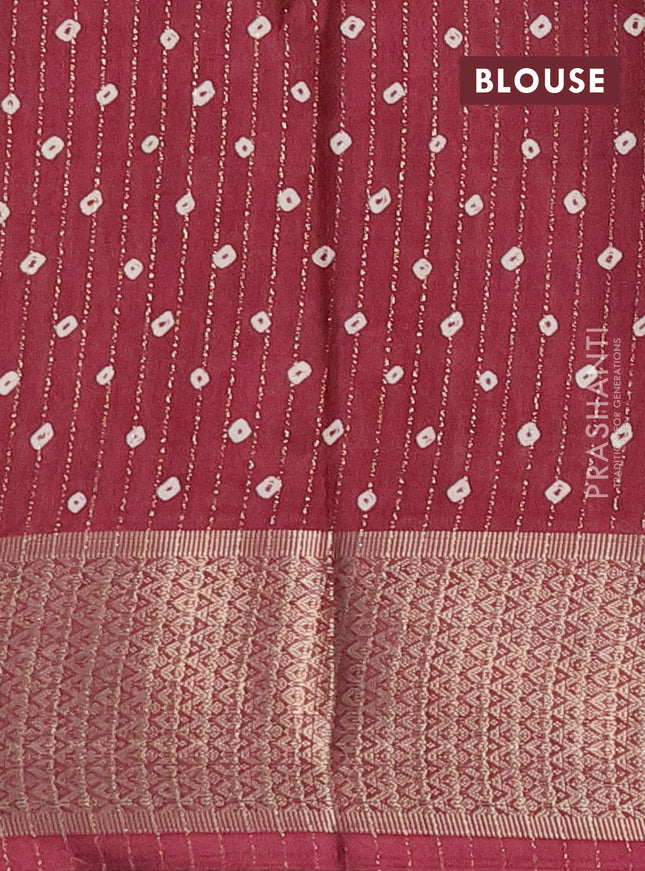 Semi dola saree maroon with allover zari weaves & batik prints and zari woven border