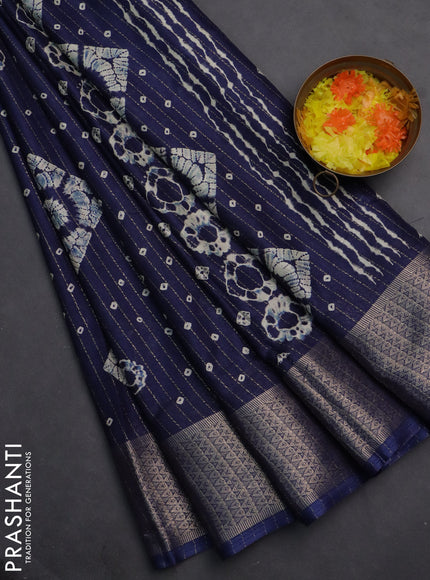 Semi dola saree navy blue with allover zari weaves & batik prints and zari woven border