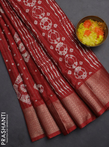 Semi dola saree maroon with allover zari weaves & batik prints and zari woven border