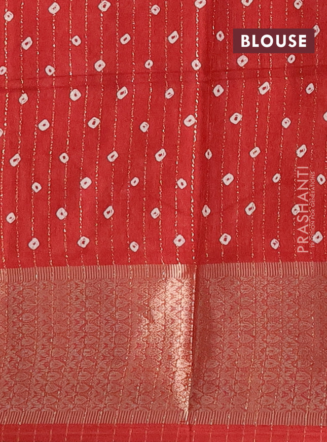Semi dola saree maroon with allover zari weaves & batik prints and zari woven border