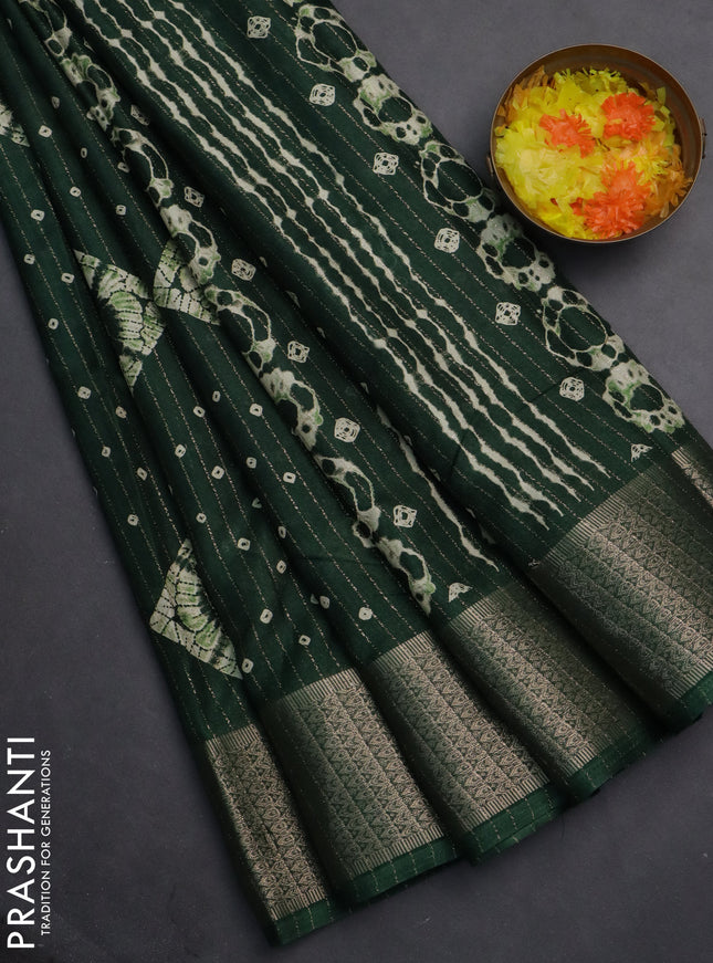 Semi dola saree green with allover zari weaves & batik prints and zari woven border
