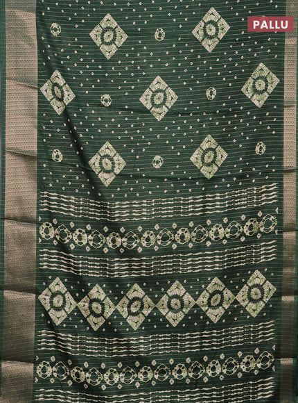 Semi dola saree green with allover zari weaves & batik prints and zari woven border