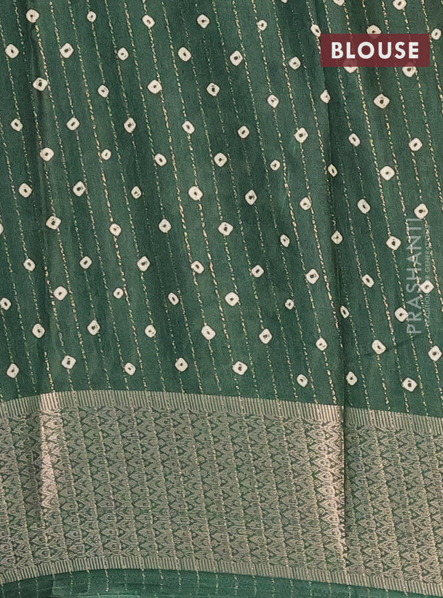 Semi dola saree green with allover zari weaves & batik prints and zari woven border