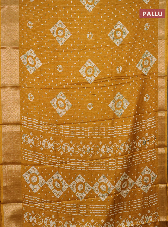 Semi dola saree mustard yellow with allover zari weaves & batik prints and zari woven border