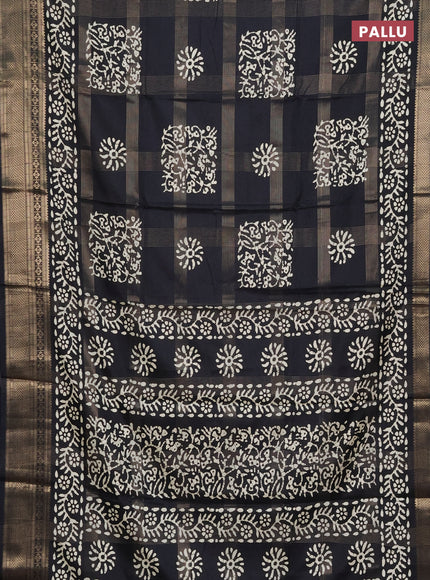 Semi dola saree black with allover zari weaves & batik prints and zari woven border