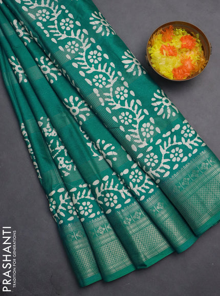 Semi dola saree teal blue with allover zari weaves & batik prints and zari woven border