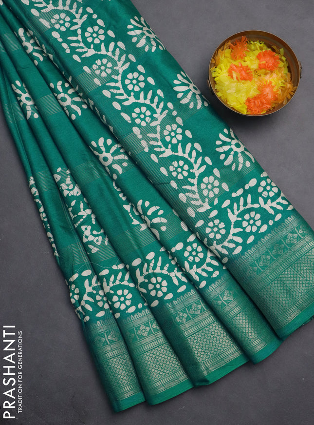 Semi dola saree teal blue with allover zari weaves & batik prints and zari woven border