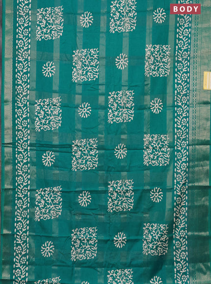 Semi dola saree teal blue with allover zari weaves & batik prints and zari woven border
