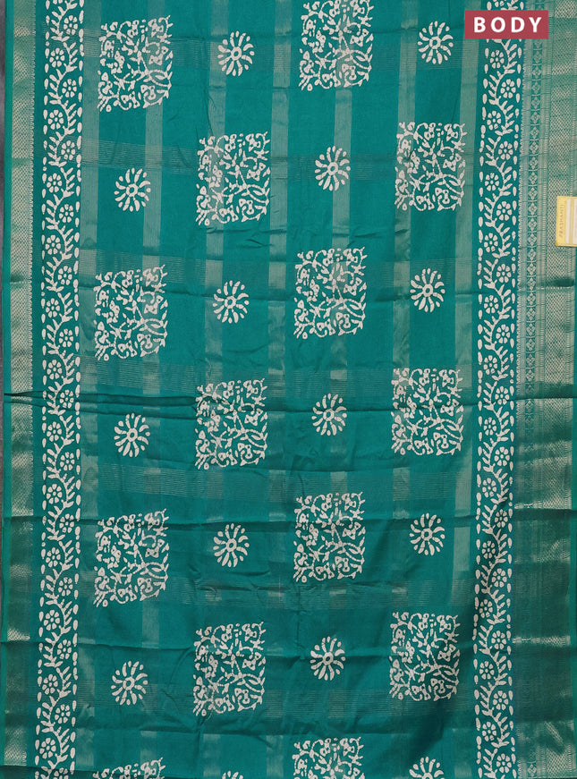 Semi dola saree teal blue with allover zari weaves & batik prints and zari woven border