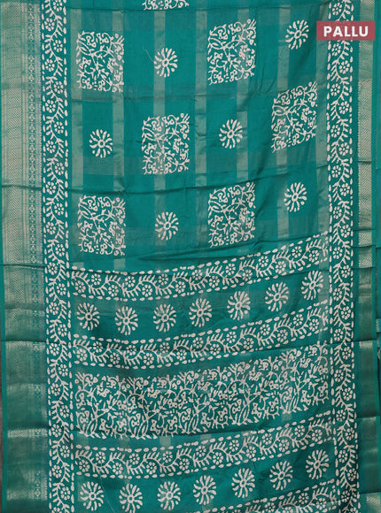 Semi dola saree teal blue with allover zari weaves & batik prints and zari woven border