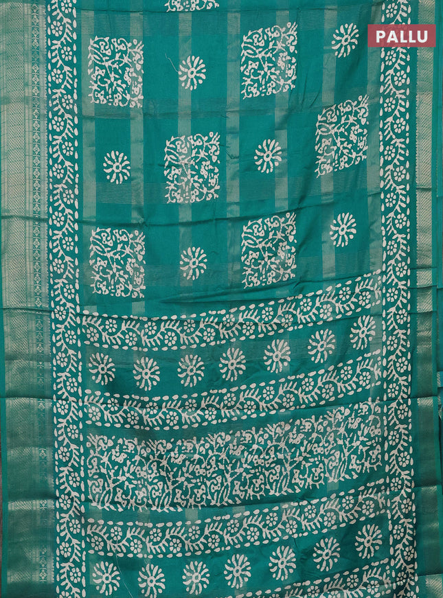 Semi dola saree teal blue with allover zari weaves & batik prints and zari woven border