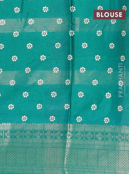Semi dola saree teal blue with allover zari weaves & batik prints and zari woven border