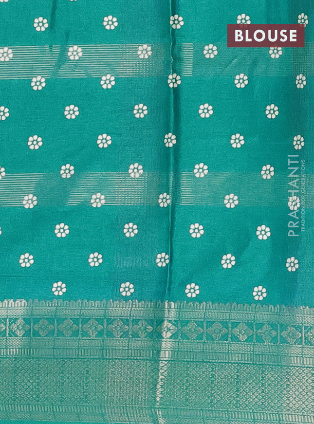 Semi dola saree teal blue with allover zari weaves & batik prints and zari woven border