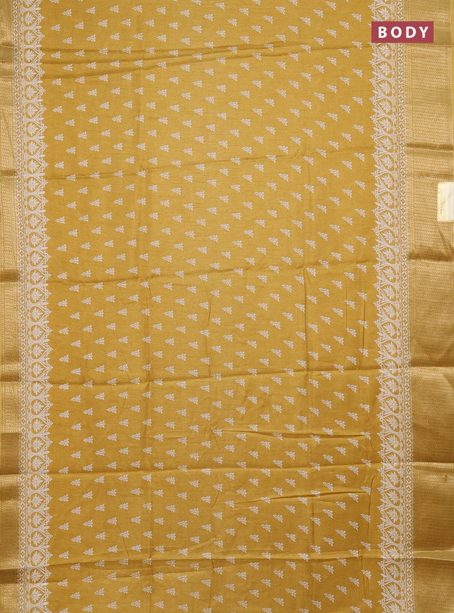 Semi dola saree yellow with butta prints and zari woven border