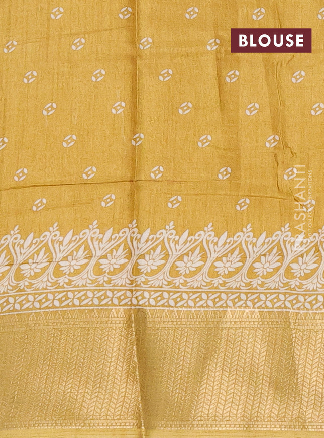 Semi dola saree yellow with butta prints and zari woven border