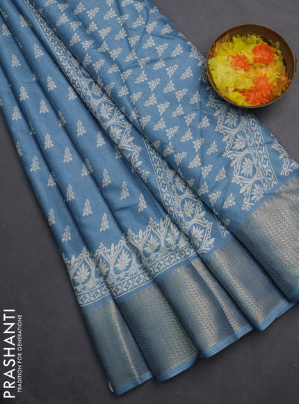 Semi dola saree blue shade with butta prints and zari woven border