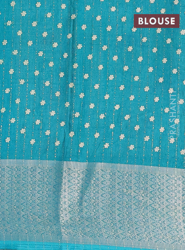 Semi dola saree teal green with allover zari weaves & buttas and zari woven border