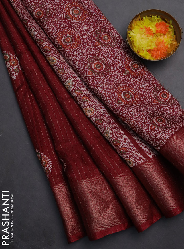 Semi dola saree maroon with allover zari weaves & buttas and zari woven border