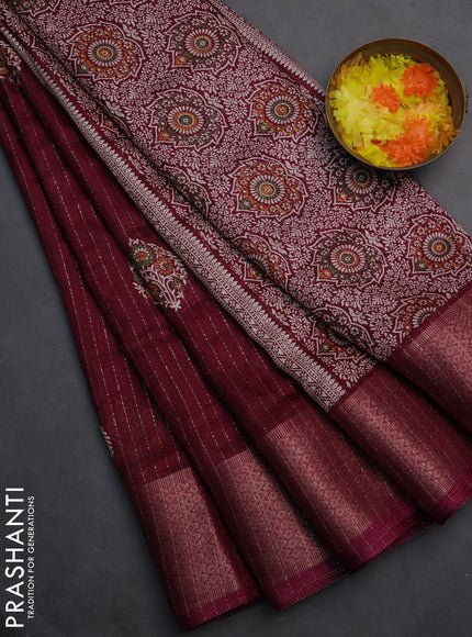 Semi dola saree wine shade with allover zari weaves & buttas and zari woven border