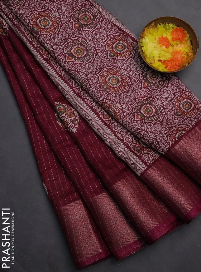 Semi dola saree wine shade with allover zari weaves & buttas and zari woven border