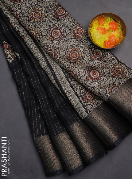 Semi dola saree black with allover zari weaves & buttas and zari woven border