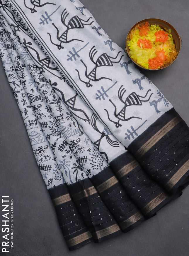 Semi dola saree off white and black with allover warli prints and zari woven sequin work border