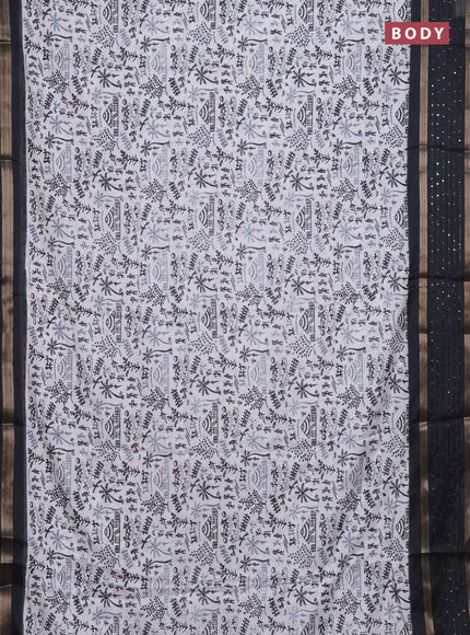 Semi dola saree off white and black with allover warli prints and zari woven sequin work border