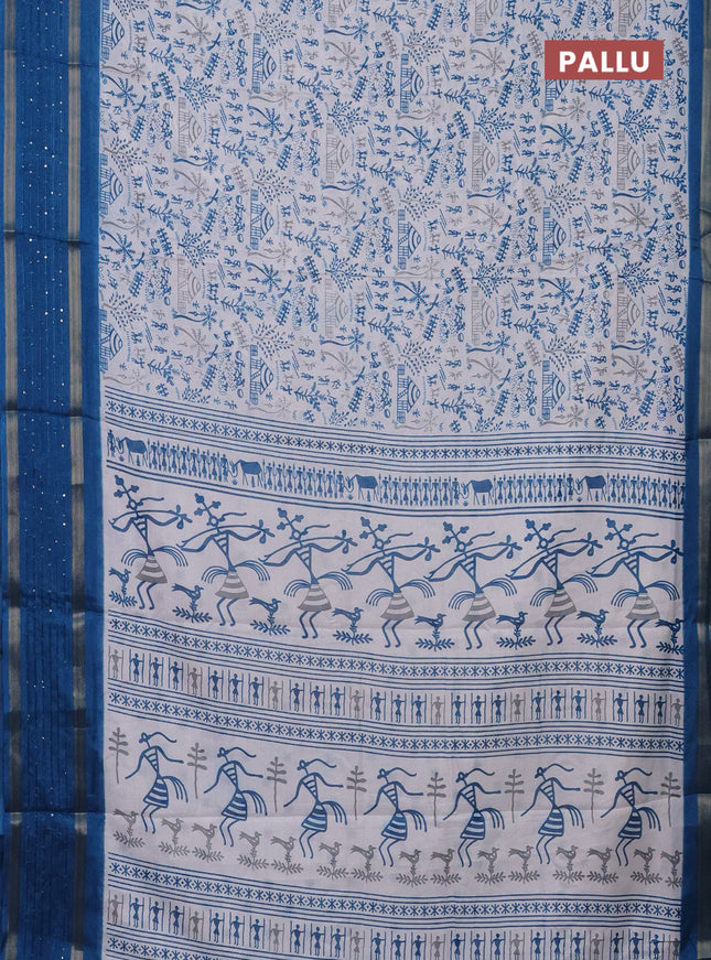 Semi dola saree off white and cs blue with allover warli prints and zari woven sequin work border