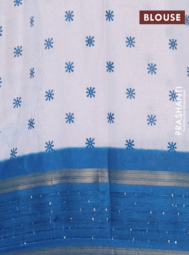 Semi dola saree off white and cs blue with allover warli prints and zari woven sequin work border